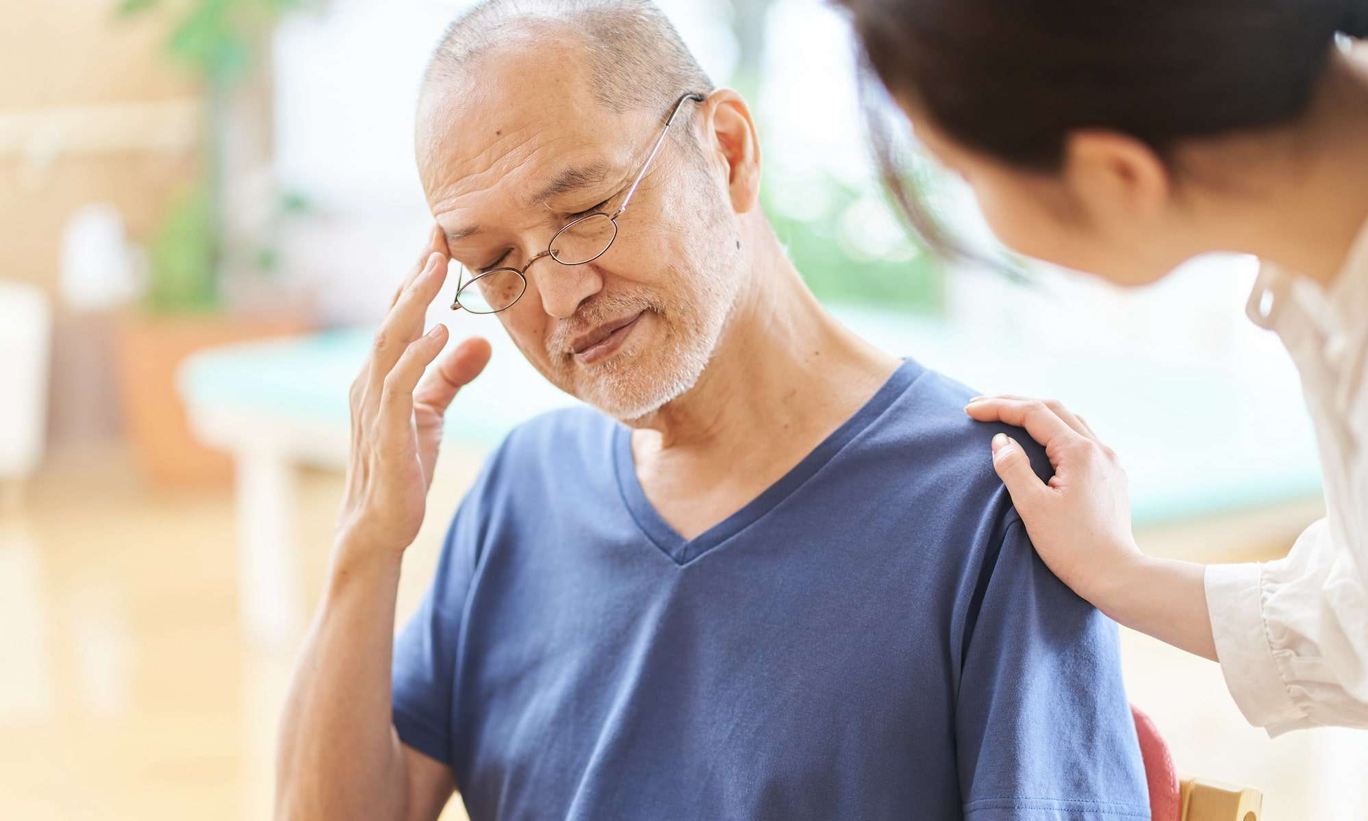 senior man receiving bad news